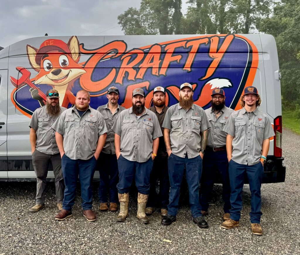 Eight Crafty Fox field technicians with a service van at the Rocky Mount, Virginia shop