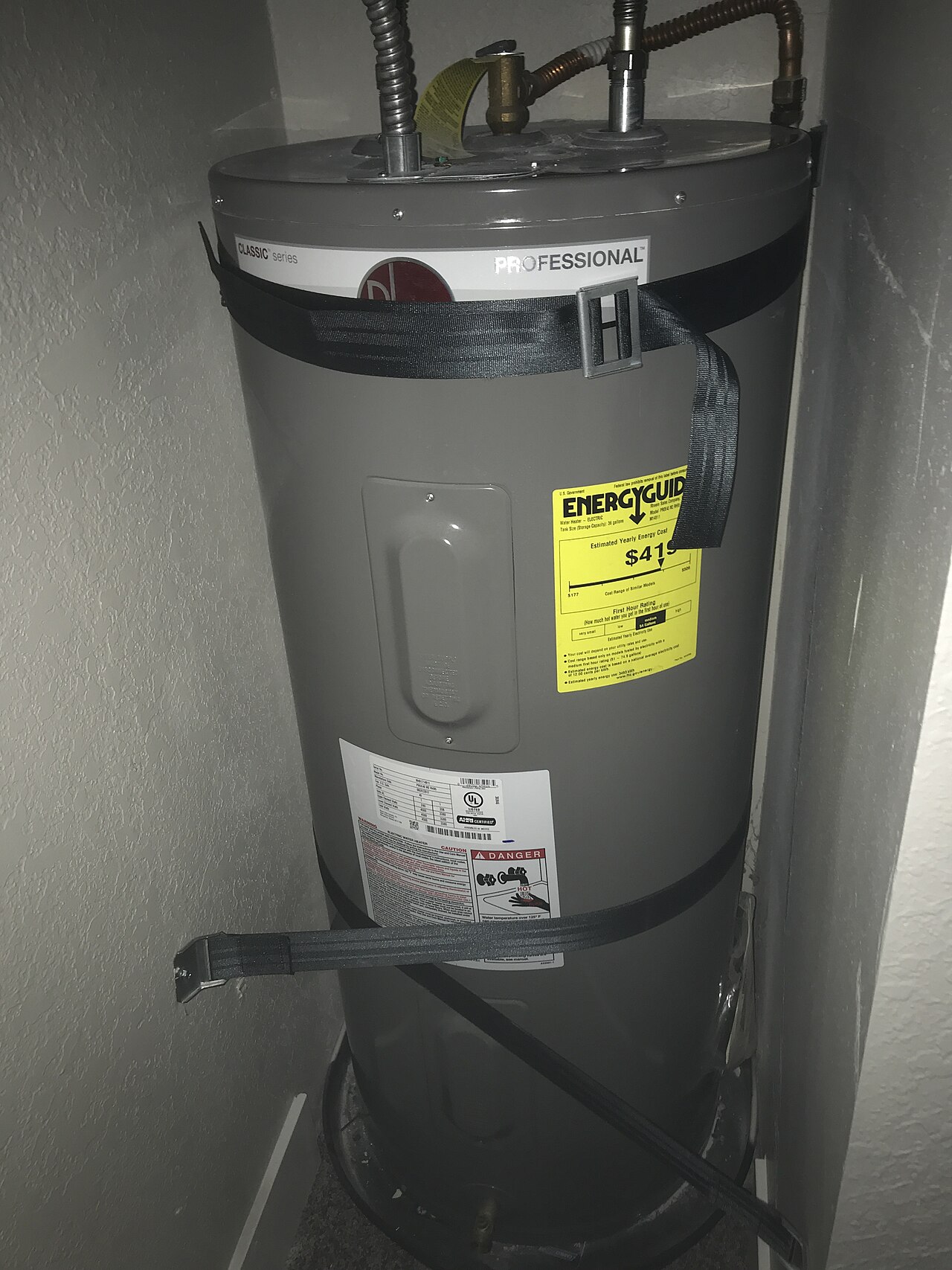 Rheem electric storage water heater installed in an indoor utility closet